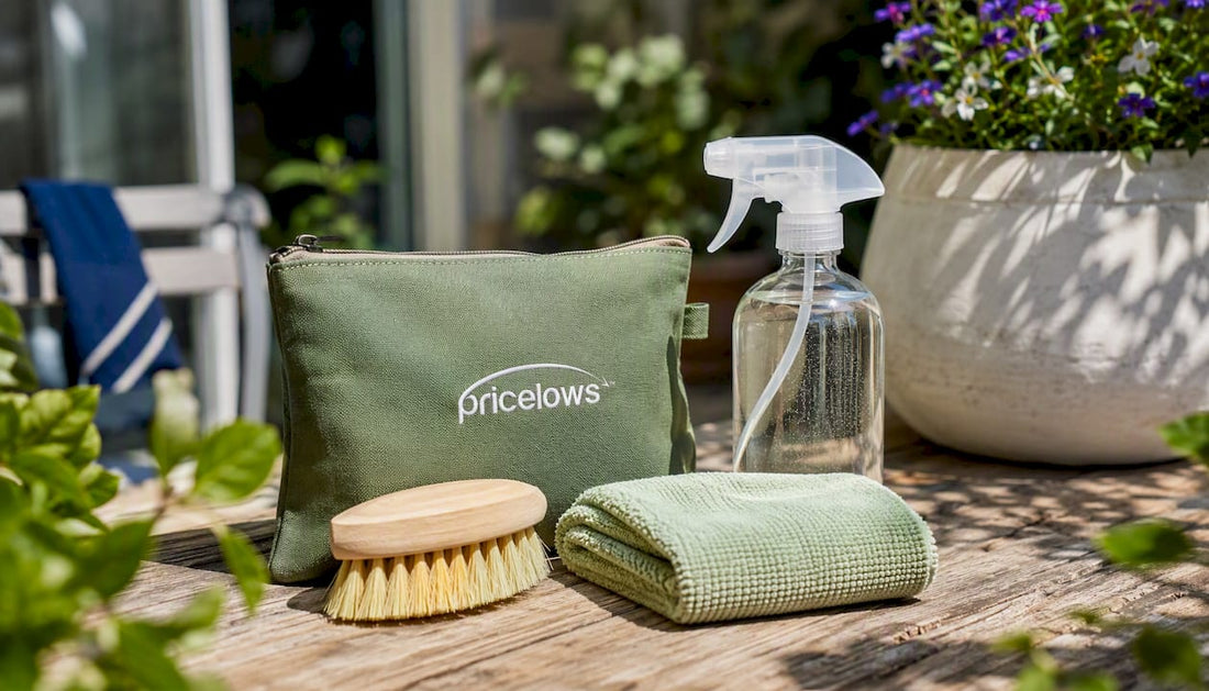 Eco-friendly cleaning tools on kitchen counter with logo