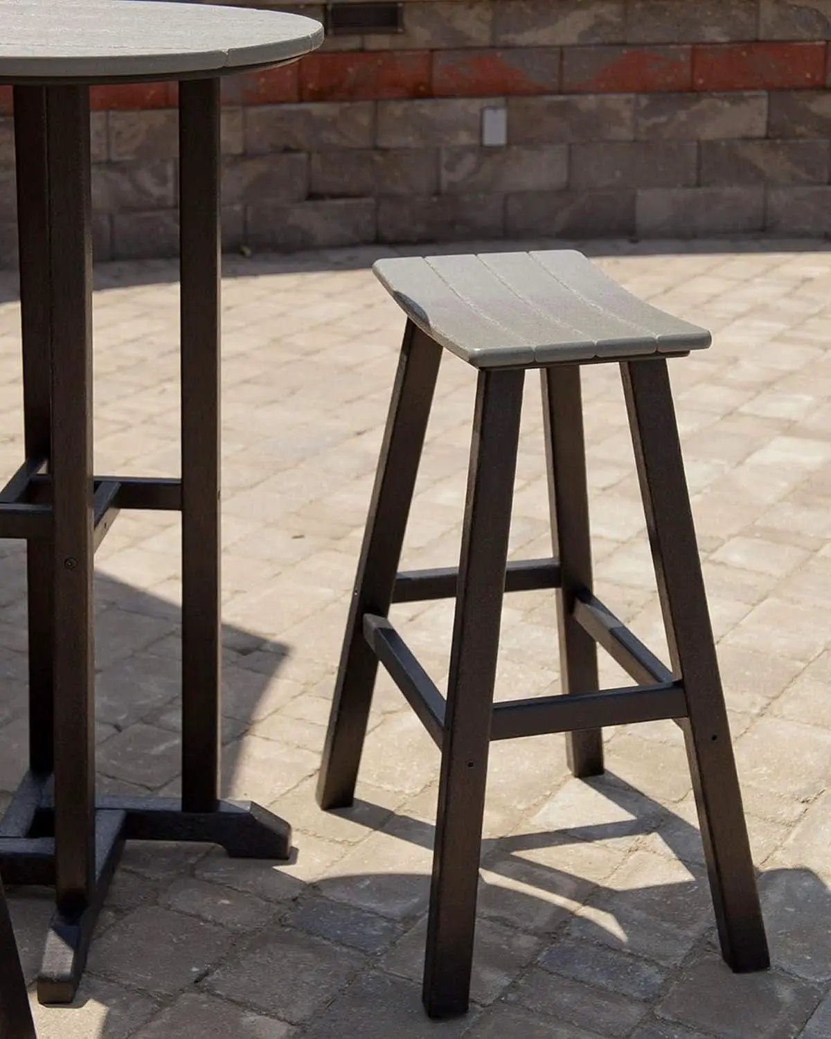 Contempo Bar Height Saddle Seat Bar Stool Black Frame Sand Seat Weatherproof Polywood Construction from PriceLows™