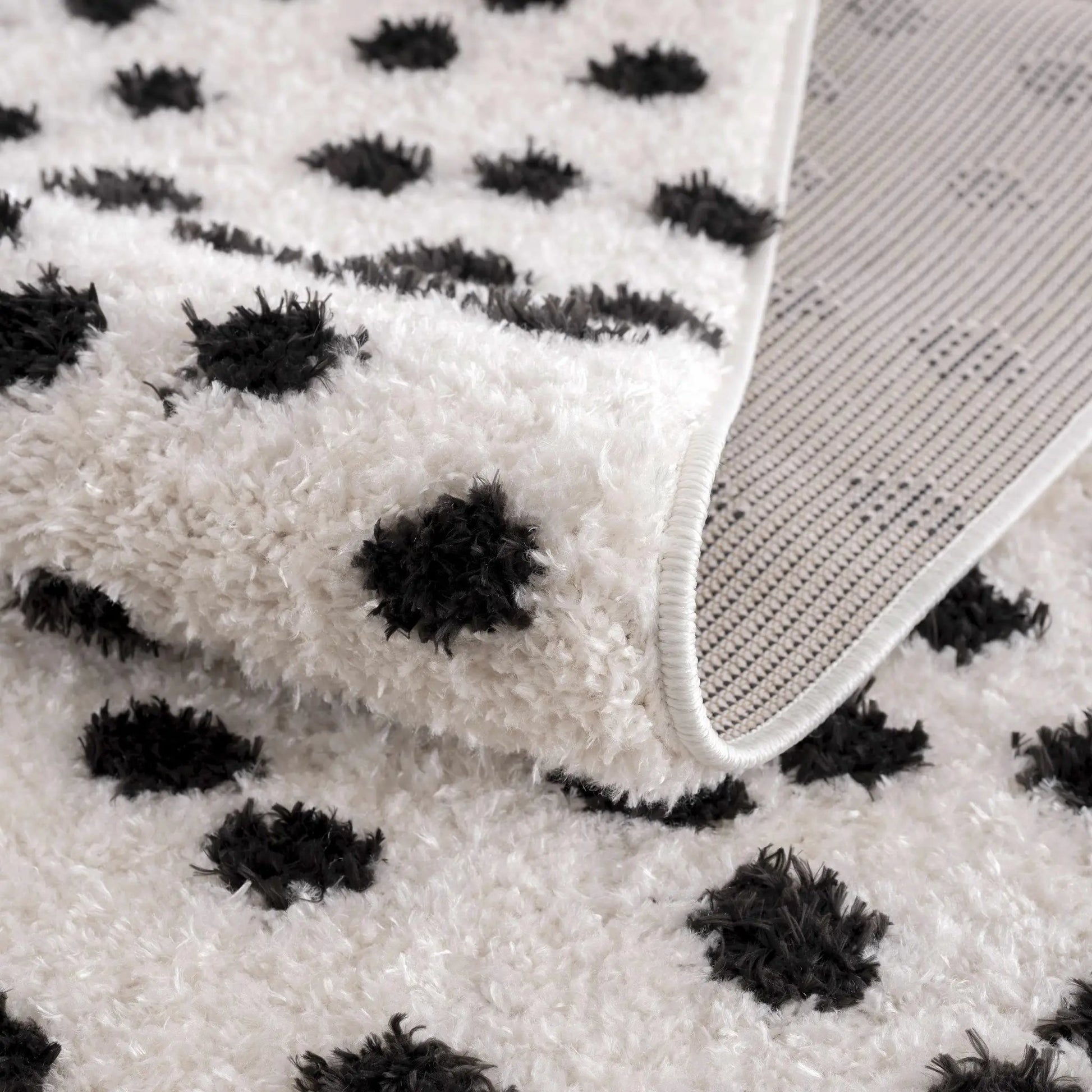 Cansu Black & White Dotted Area Rug from PriceLows™