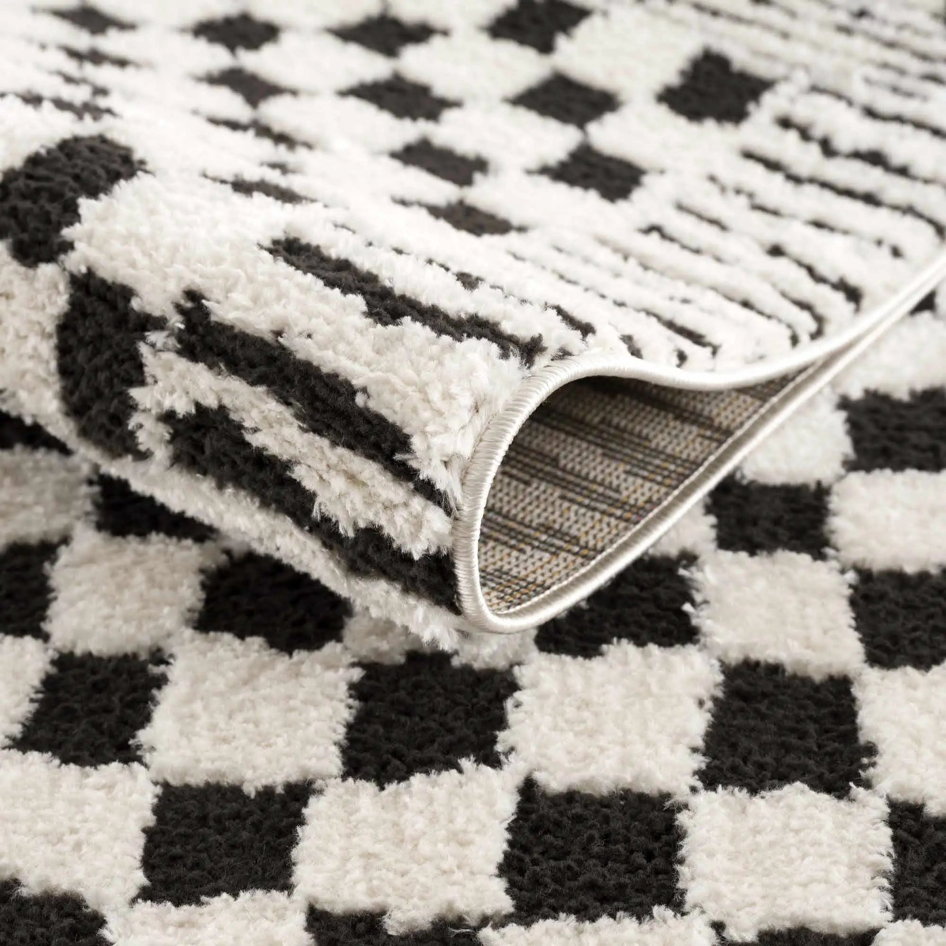 Leryn Black & White Checkered Area Rug from PriceLows™