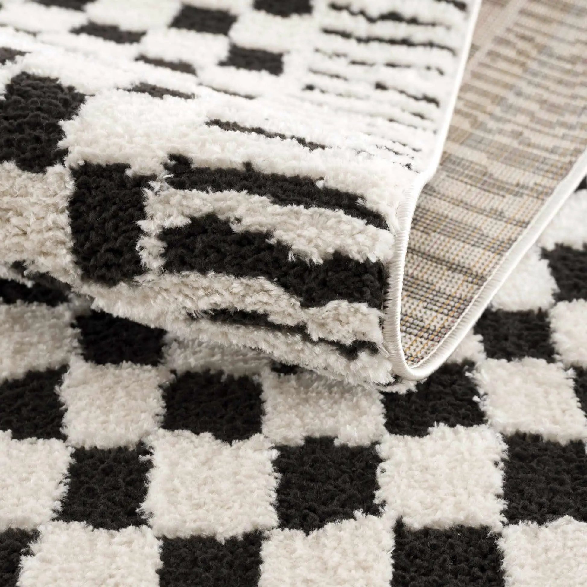 Leryn Black & White Checkered Area Rug from PriceLows™