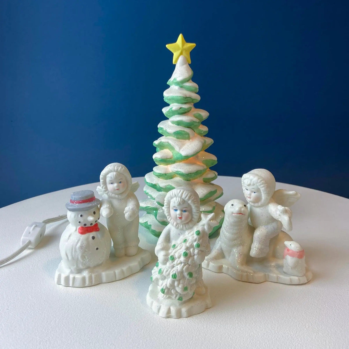 Polar Pals Playing in Snow Under Lit Christmas Tree | 3 White Porcelain Cupid Figurines Celebrating Friendship | Kids Room | Collectors & Hosts