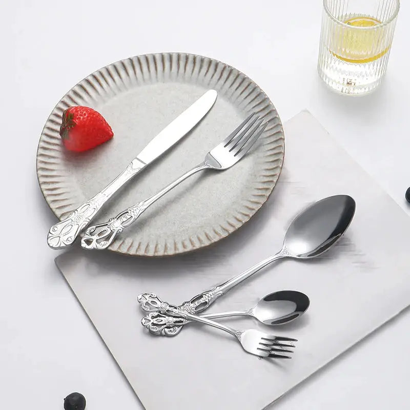 40pcs elegant silver cutlery set features stainless steel openwork handles and includes forks, spoons, and knives. Perfect for w from PriceLows™