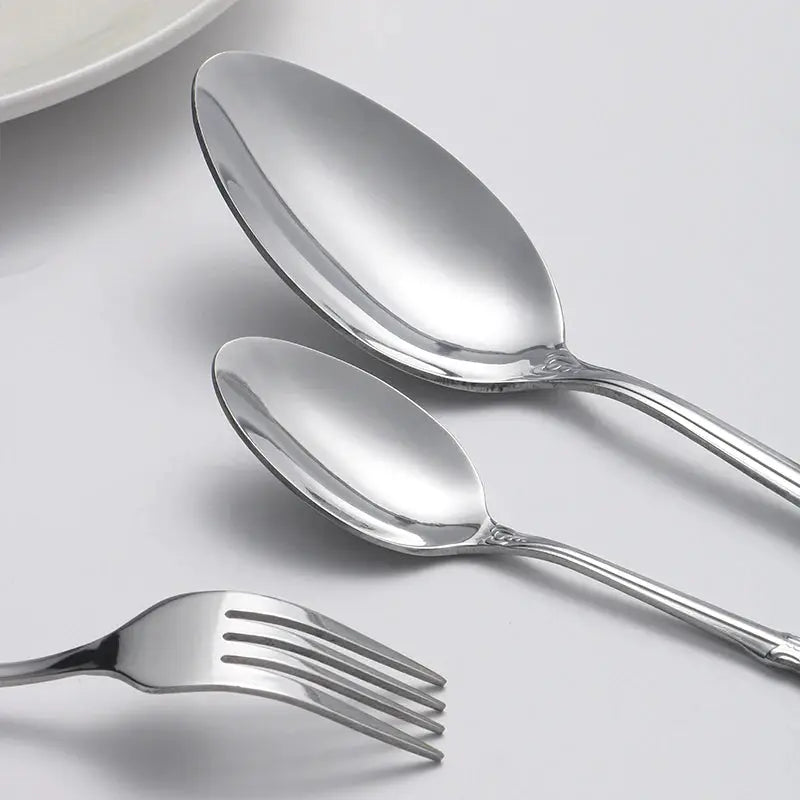 40pcs elegant silver cutlery set features stainless steel openwork handles and includes forks, spoons, and knives. Perfect for w from PriceLows™