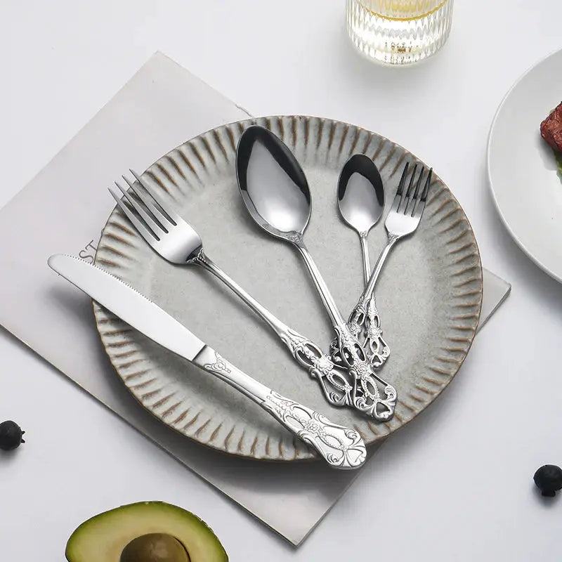 40pcs elegant silver cutlery set features stainless steel openwork handles and includes forks, spoons, and knives. Perfect for w from PriceLows™