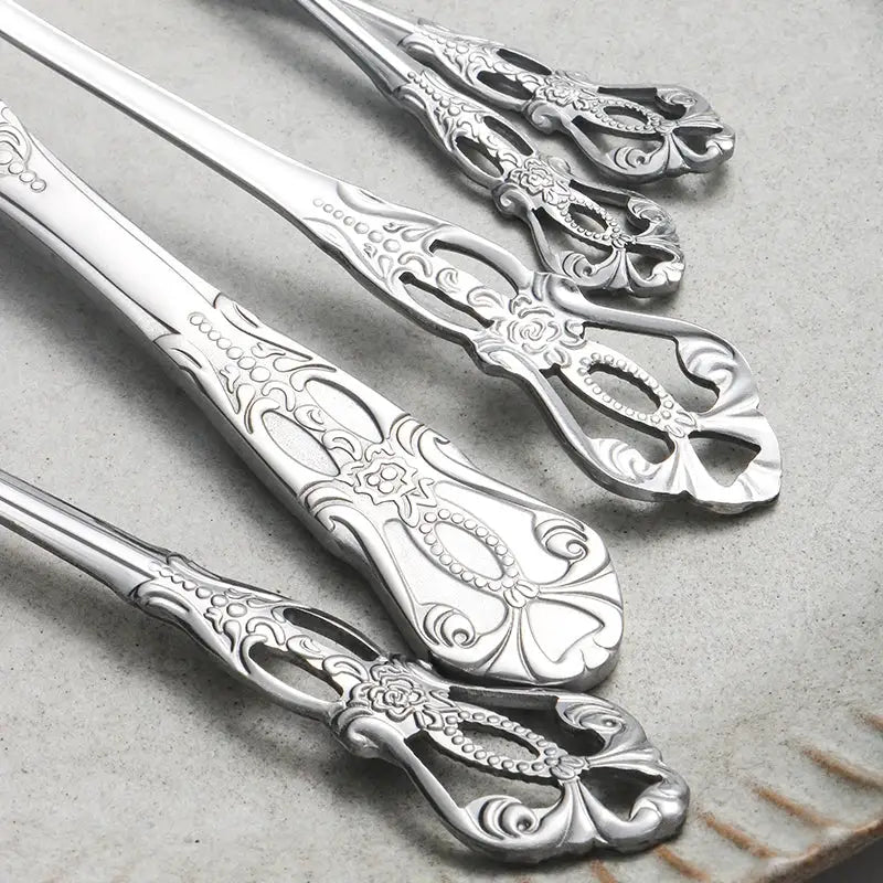 40pcs elegant silver cutlery set features stainless steel openwork handles and includes forks, spoons, and knives. Perfect for w from PriceLows™