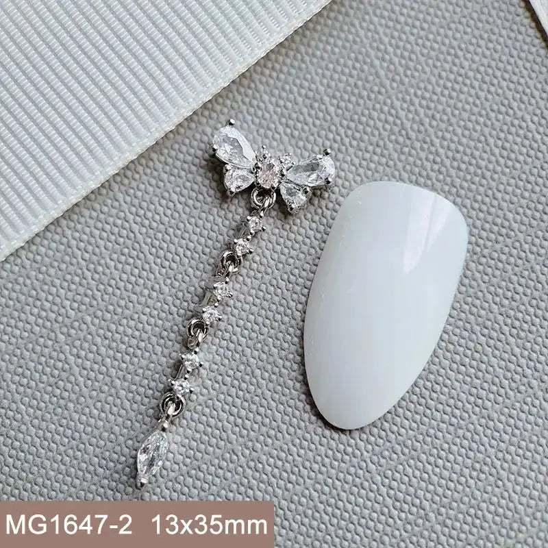 10pcs Silver Rhombus Streamer Bowknot Tassel Zircon Nails Jewelry Decorations DIY Wear Nail Art Accessories Charms Part Supplies from PriceLows™