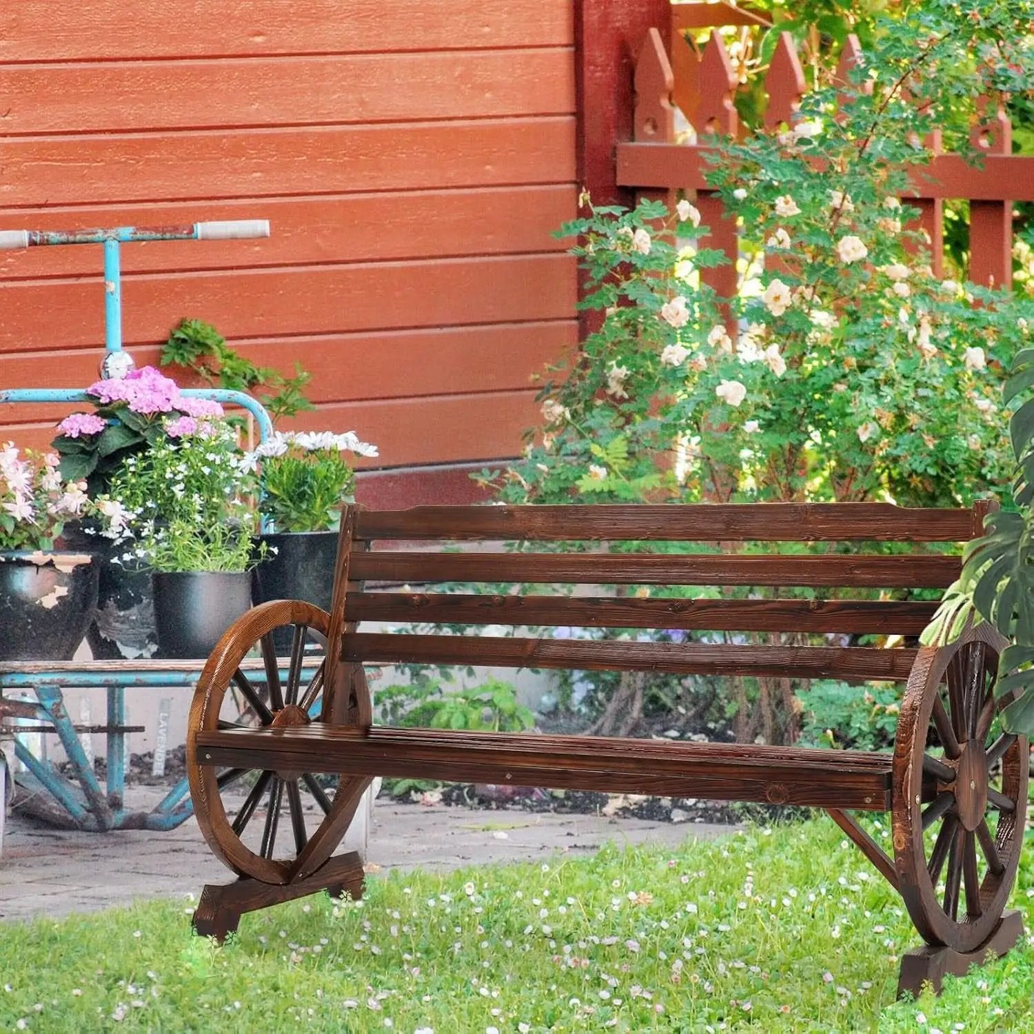 Rustic Wooden Garden Bench with Wagon Wheel Arms from PriceLows™