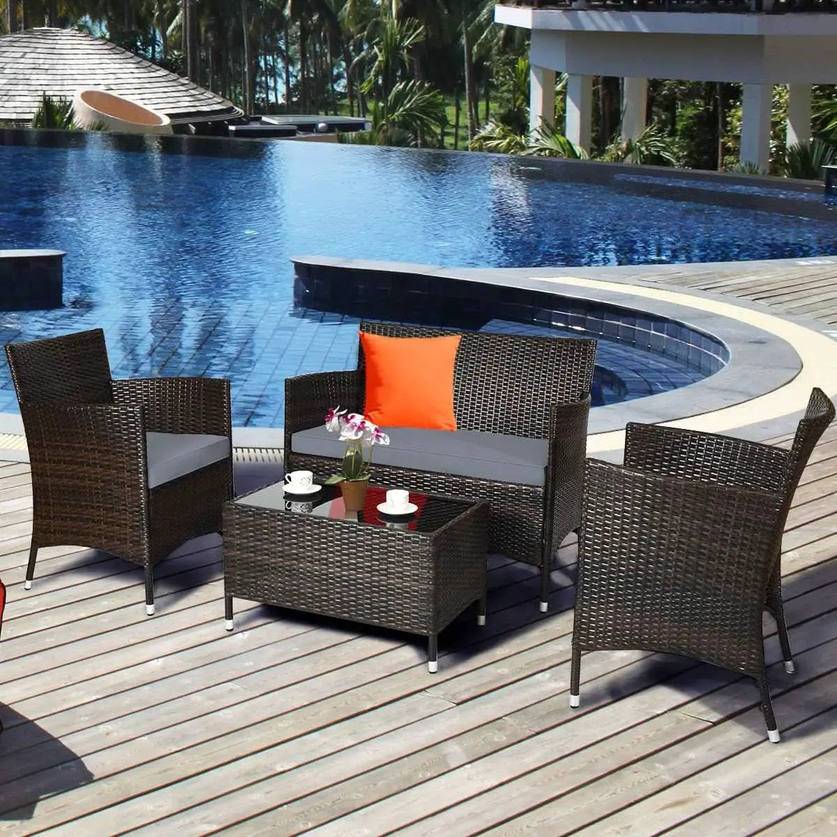 Elegant Four-Piece Rattan Patio Set with Soft Cushions from PriceLows™