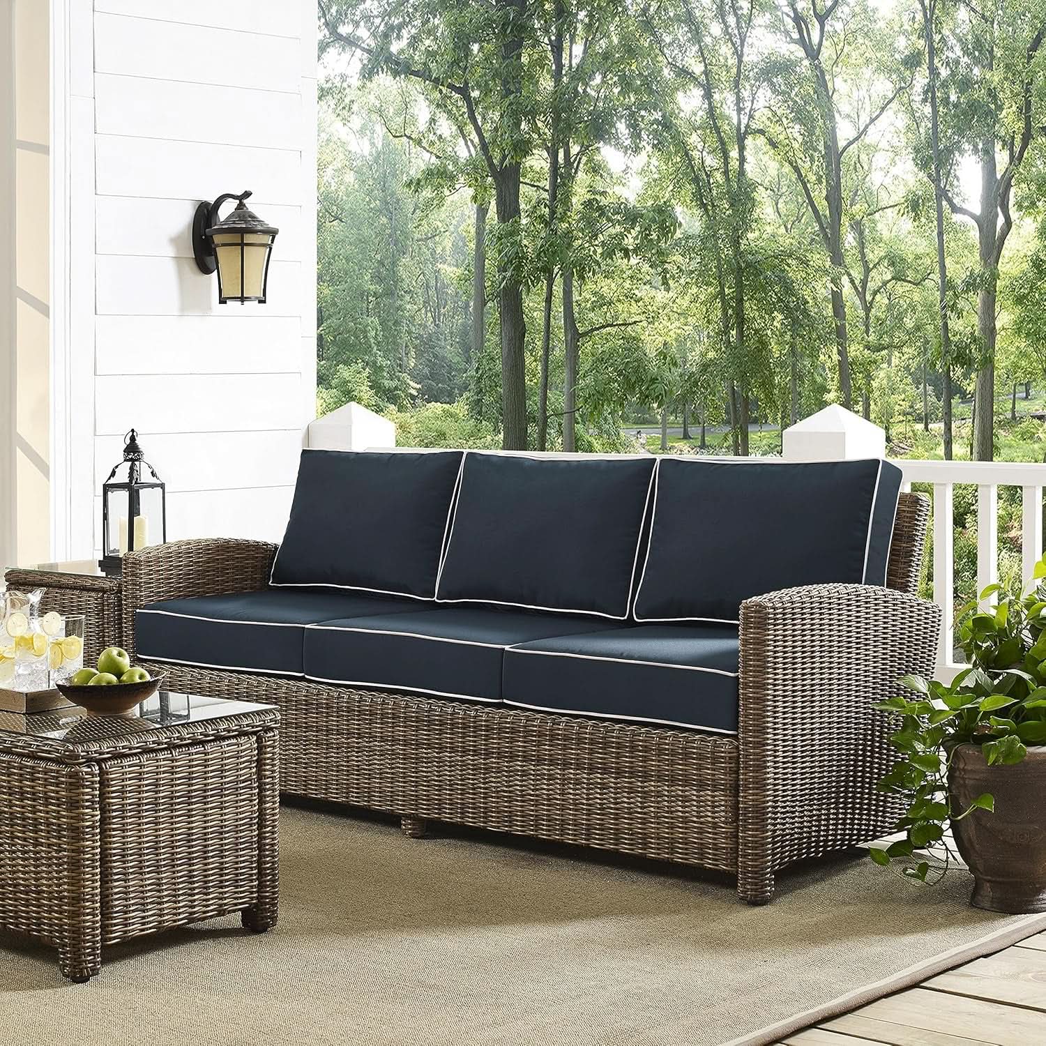 Brown Wicker Outdoor Sofa with Navy Cushions for Comfort from PriceLows™