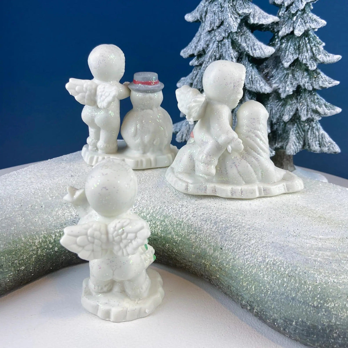 Polar Pals Playing in Snow Under Lit Christmas Tree | 3 White Porcelain Cupid Figurines Celebrating Friendship | Kids Room | Collectors & Hosts